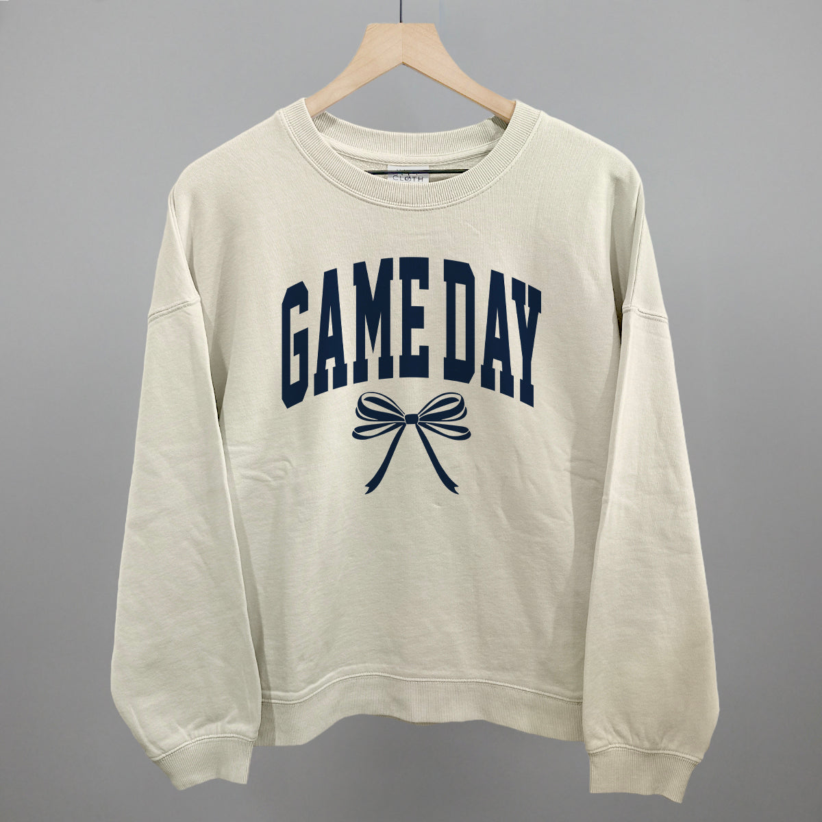Game Day arch and bow design shown in bone