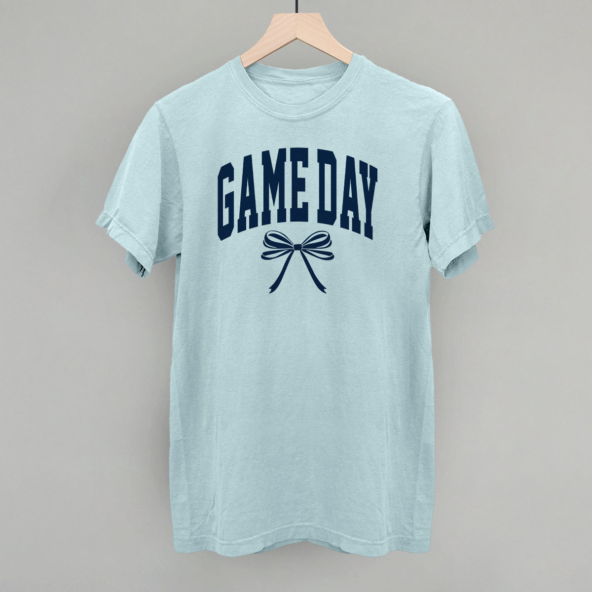 Game Day arch and bow design on a chambray Comfort Colors tee