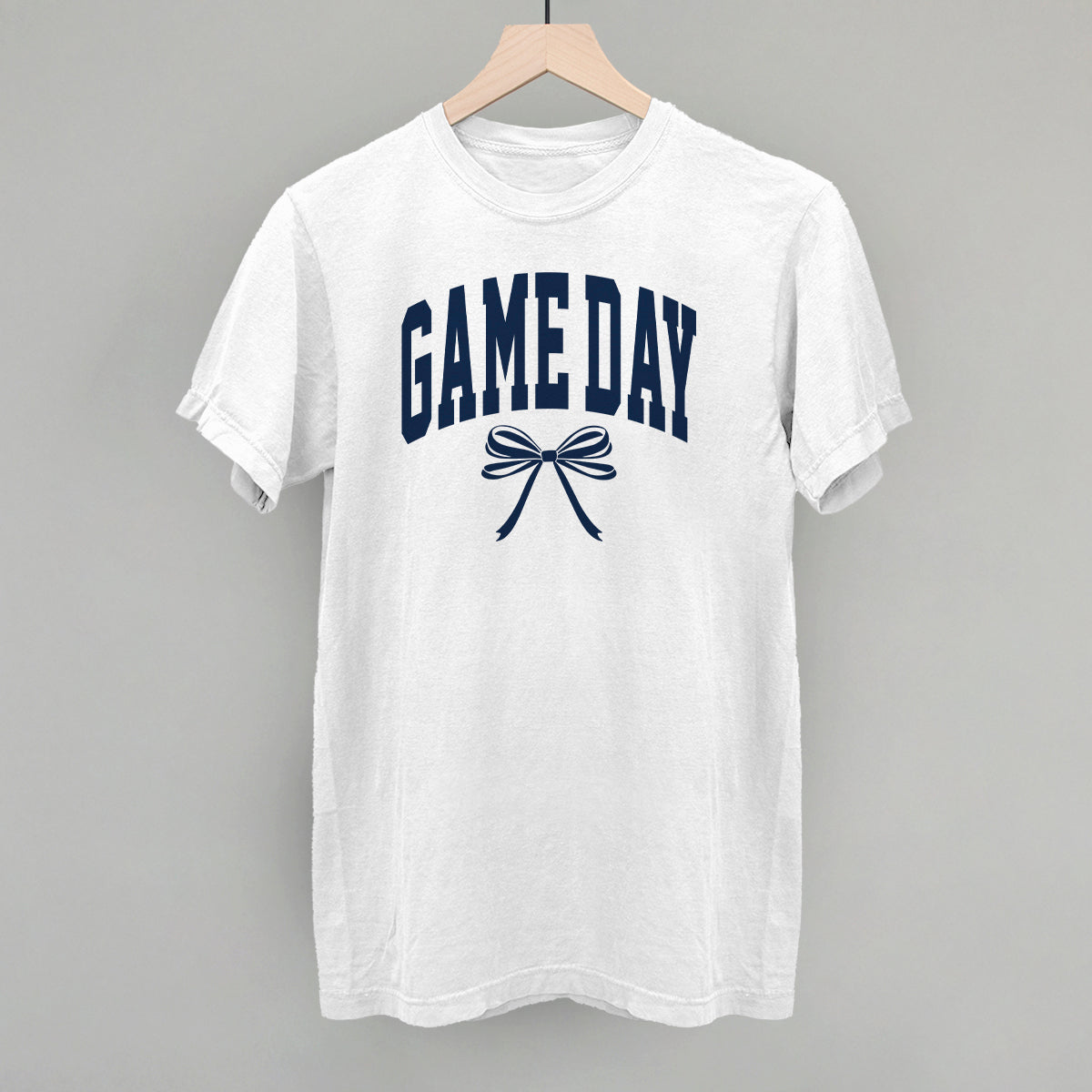 Game Day arch and bow design on a white Comfort Colors tee