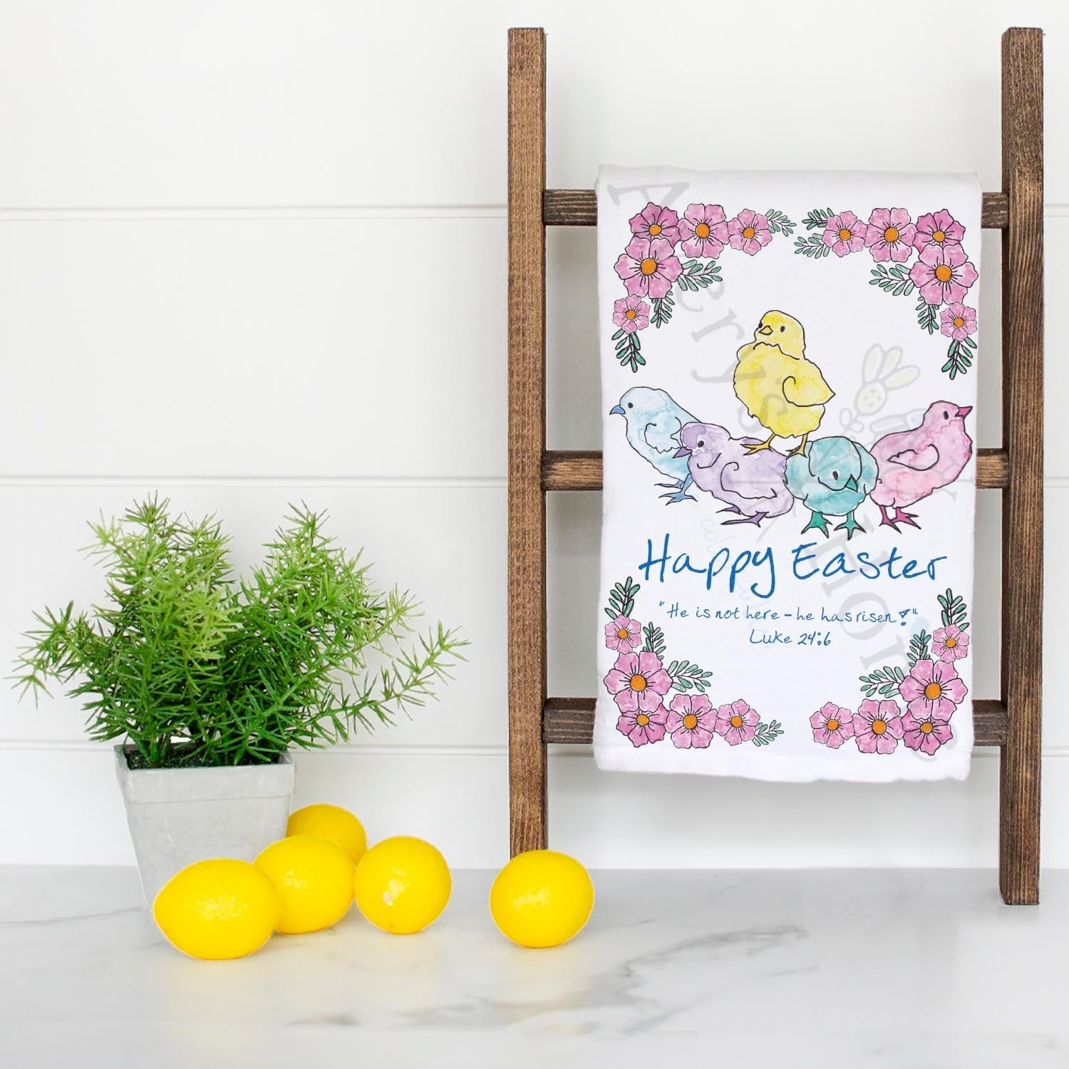 He Is Risen Easter Chicks dish towel hanging in the kitchen