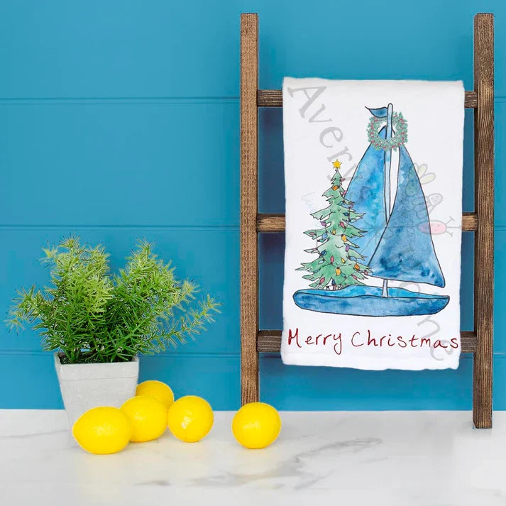 Sailboat with Christmas Tree dish towel hanging in the kitchen