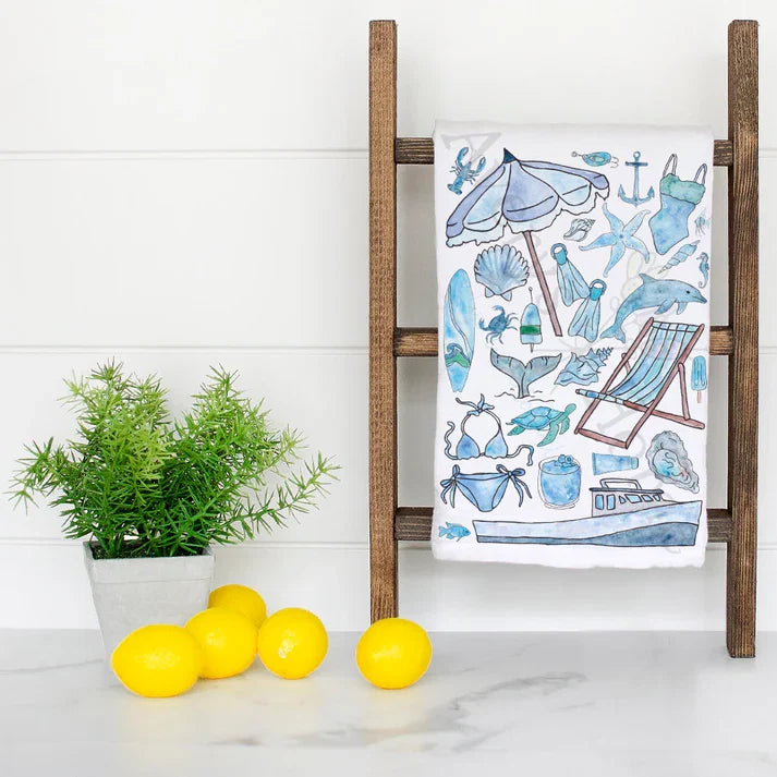 Blue Beach Day Memories dish towel hanging in the kitchen