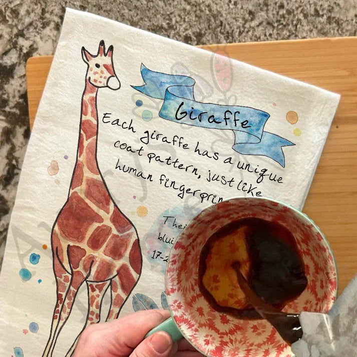 Giraffe Facts dish towel hanging in the kitchen