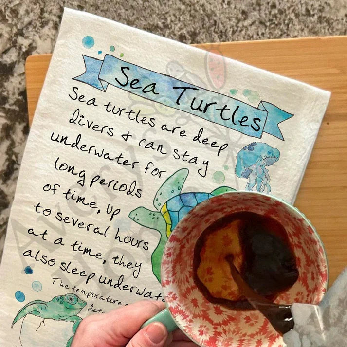 Sea Turtle Facts dish towel hanging in the kitchen