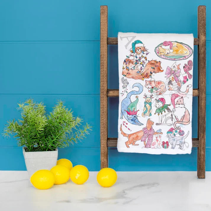 Adorable Cats Christmas dish towel hanging in the kitchen