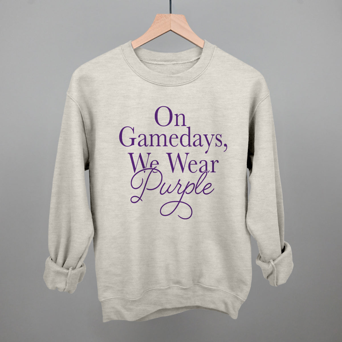 On Gamedays We Wear Purple design on an oatmeal crewneck sweatshirt