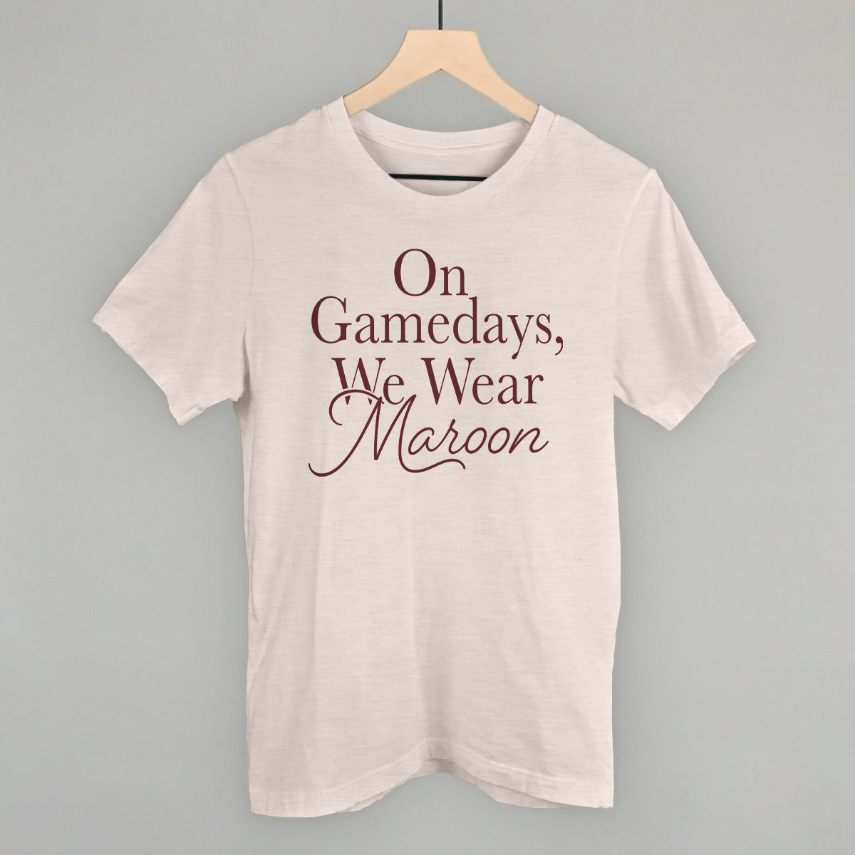 On Gamedays We Wear Maroon design on a heather cement cotton tee