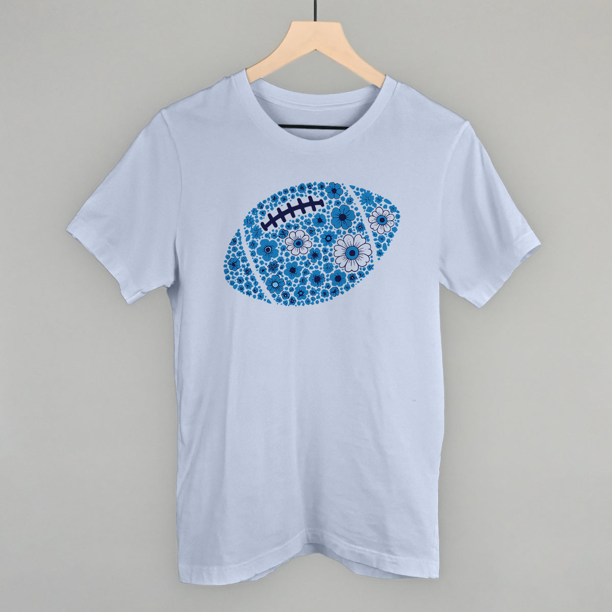 Blue floral football design on a light blue cotton tee