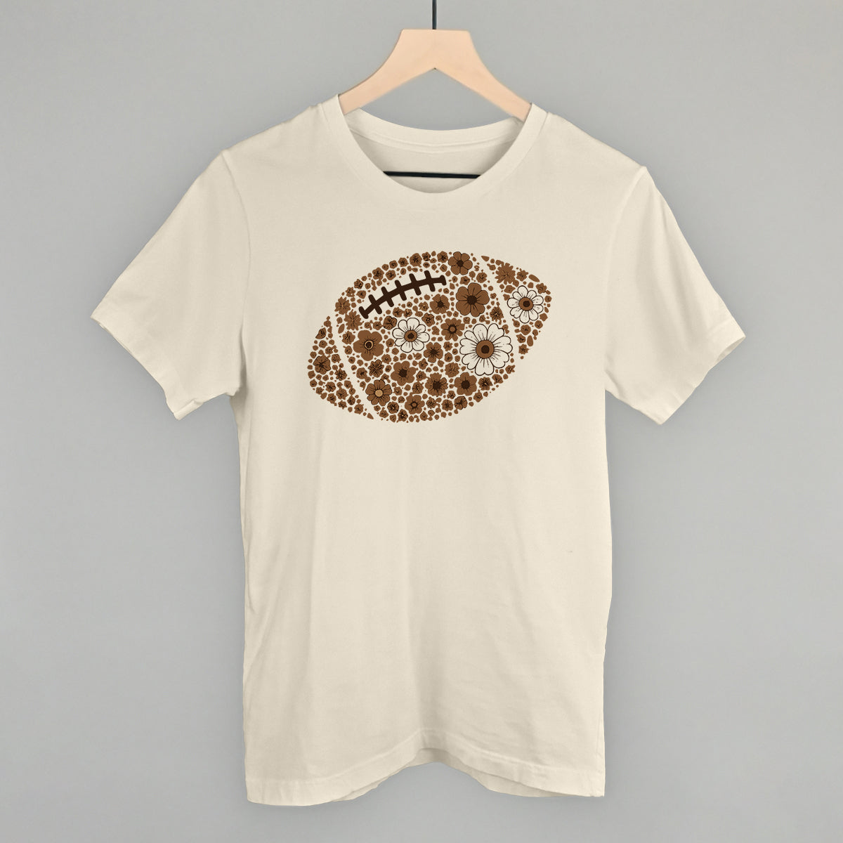 Brown floral football design on a natural cotton tee