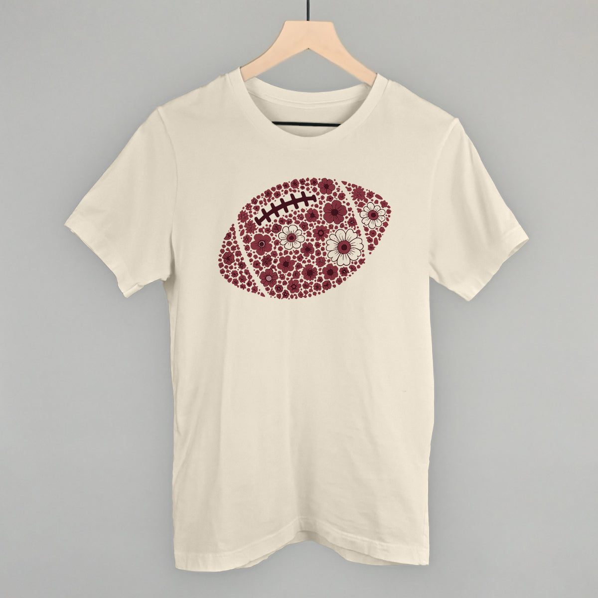 Maroon floral football design on a natural cotton tee