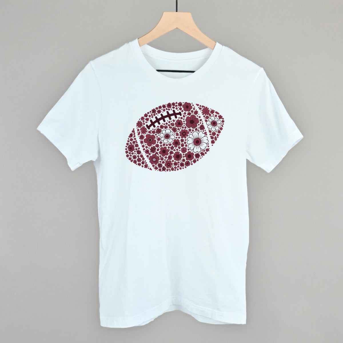 Maroon floral football design on a white cotton tee