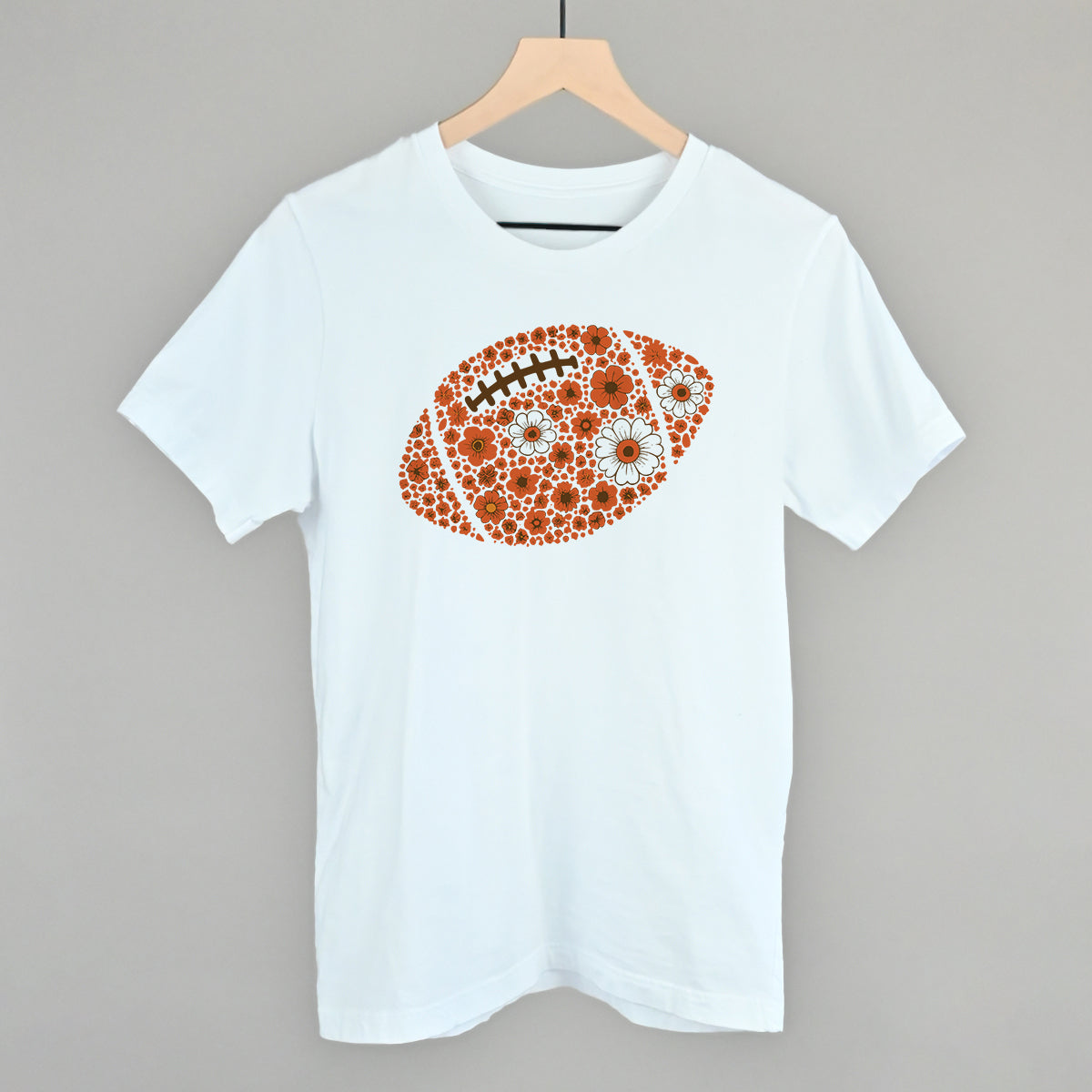 Orange floral football design on a white cotton tee