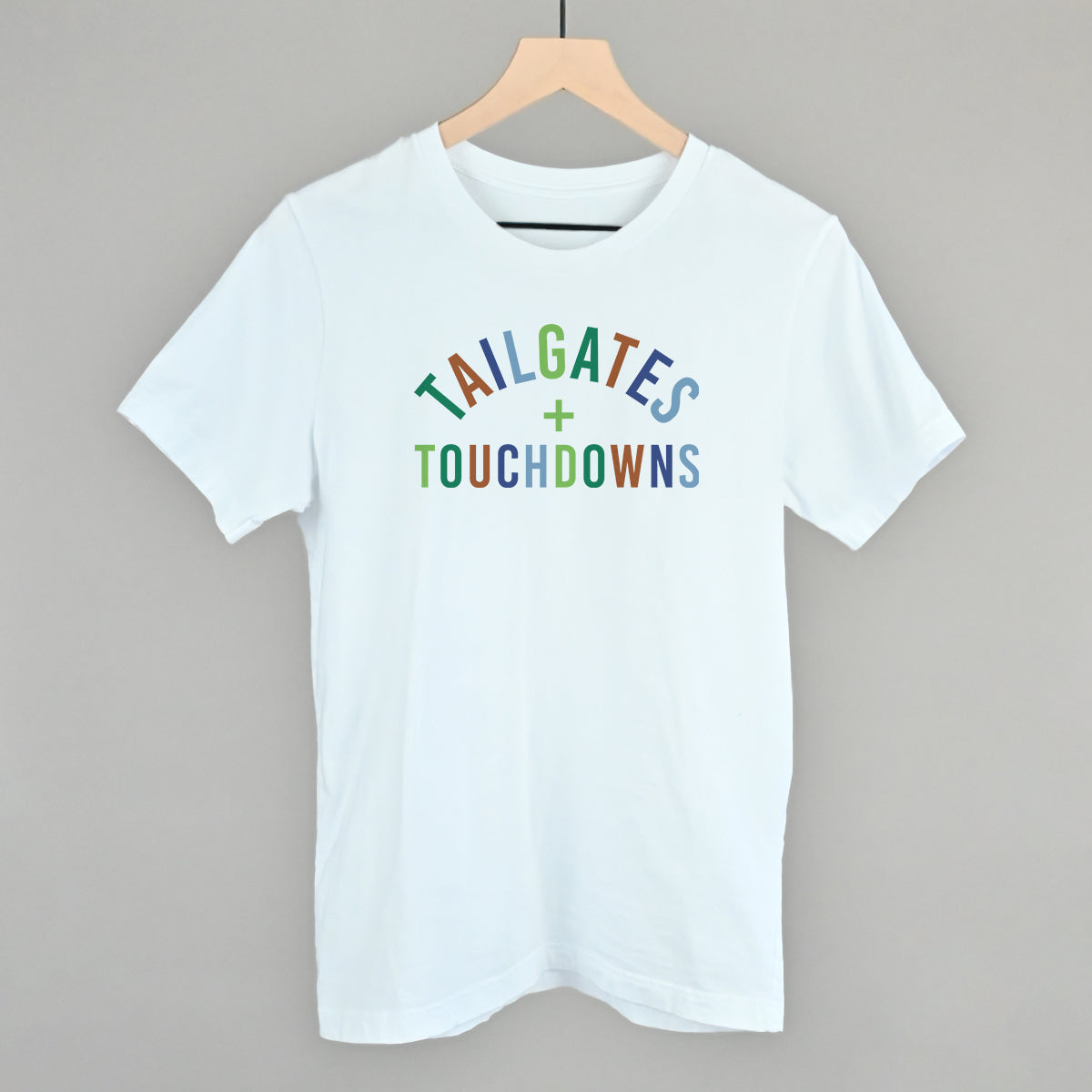 Tailgates And Touchdowns design on a white cotton tee