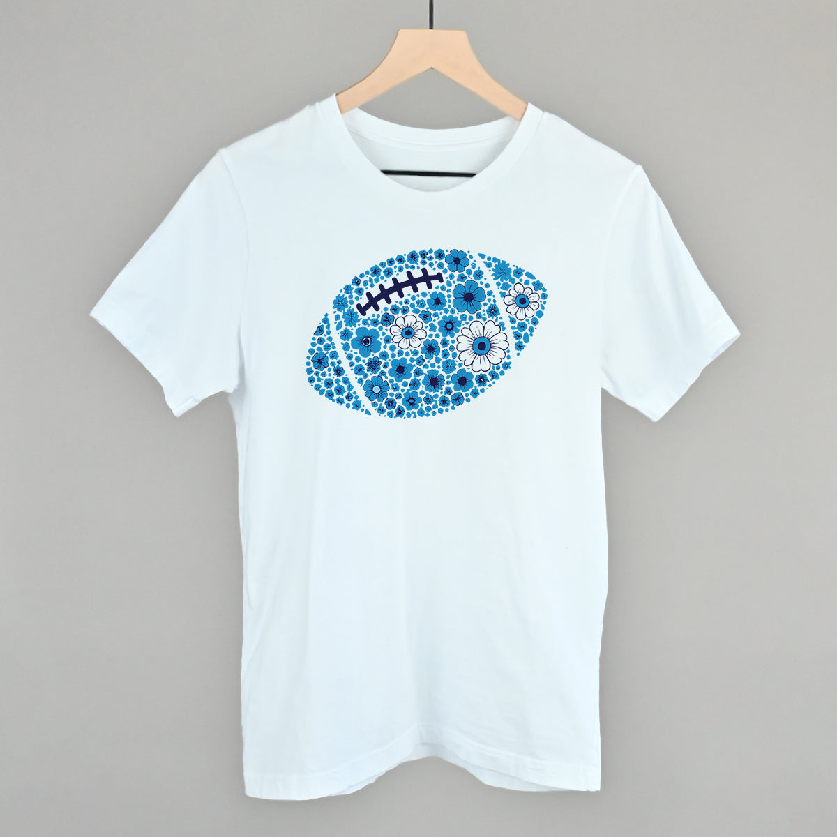 Blue floral football design on a white cotton tee