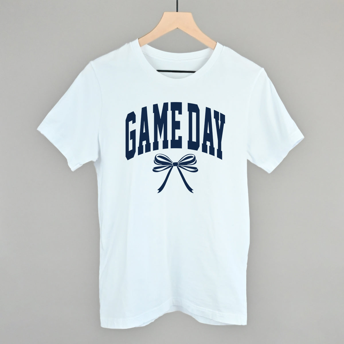 Game Day arch and bow design on a white cotton tee