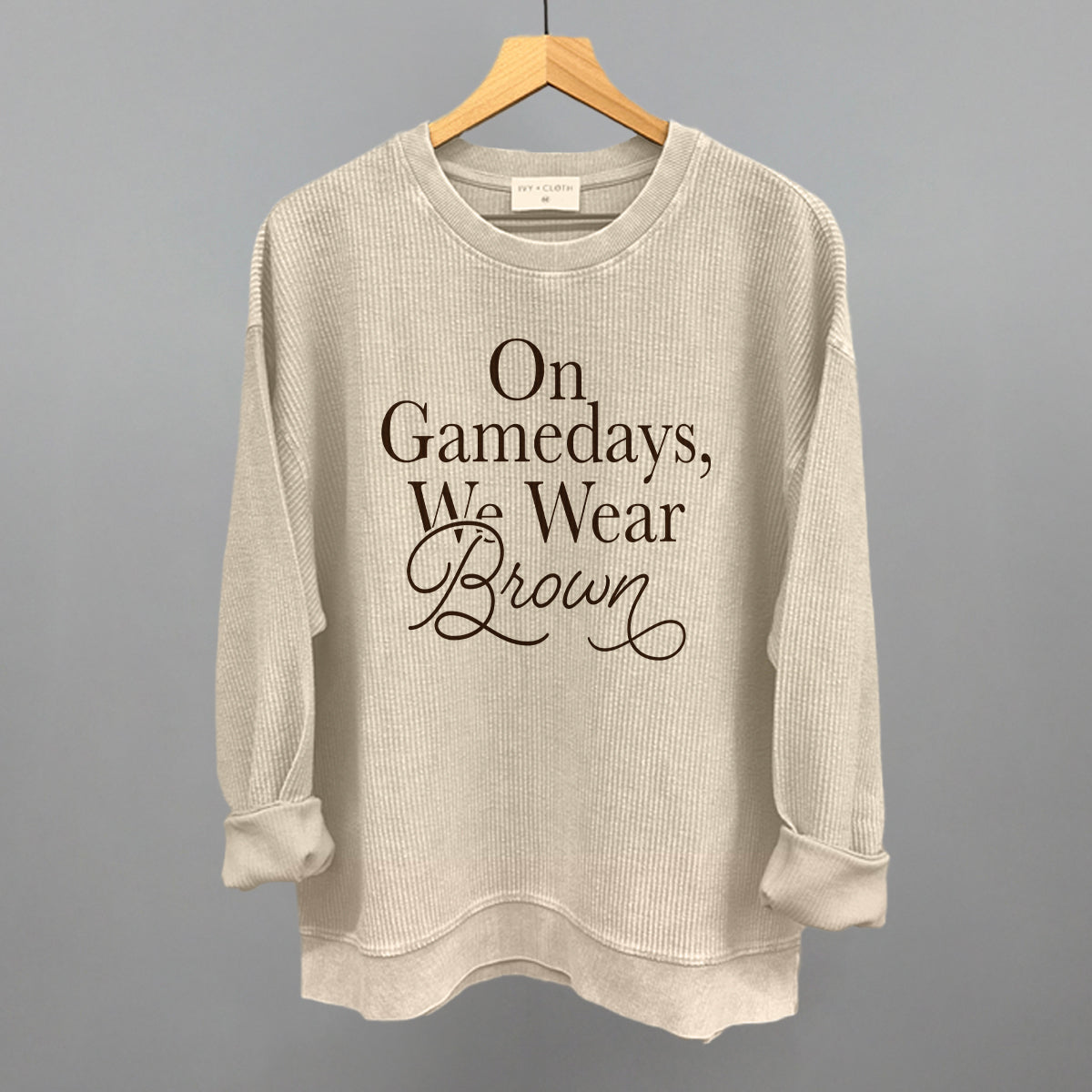 On Game Days We Wear Brown design on a moonbeam oversized corded crew