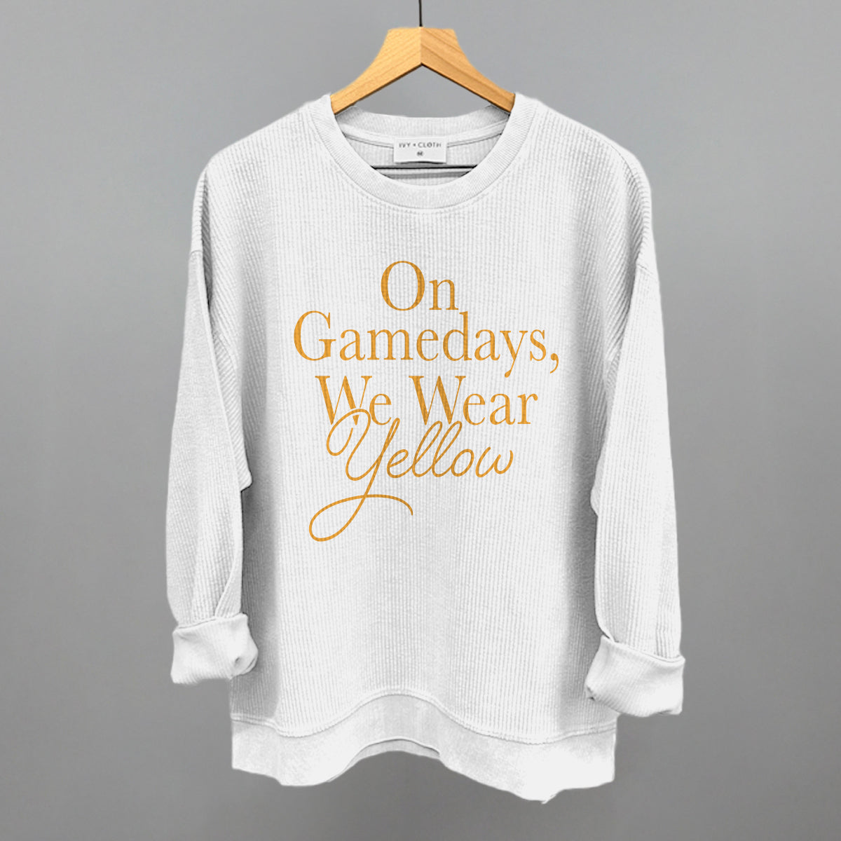On Game Days We Wear Yellow design on a white oversized corded crew