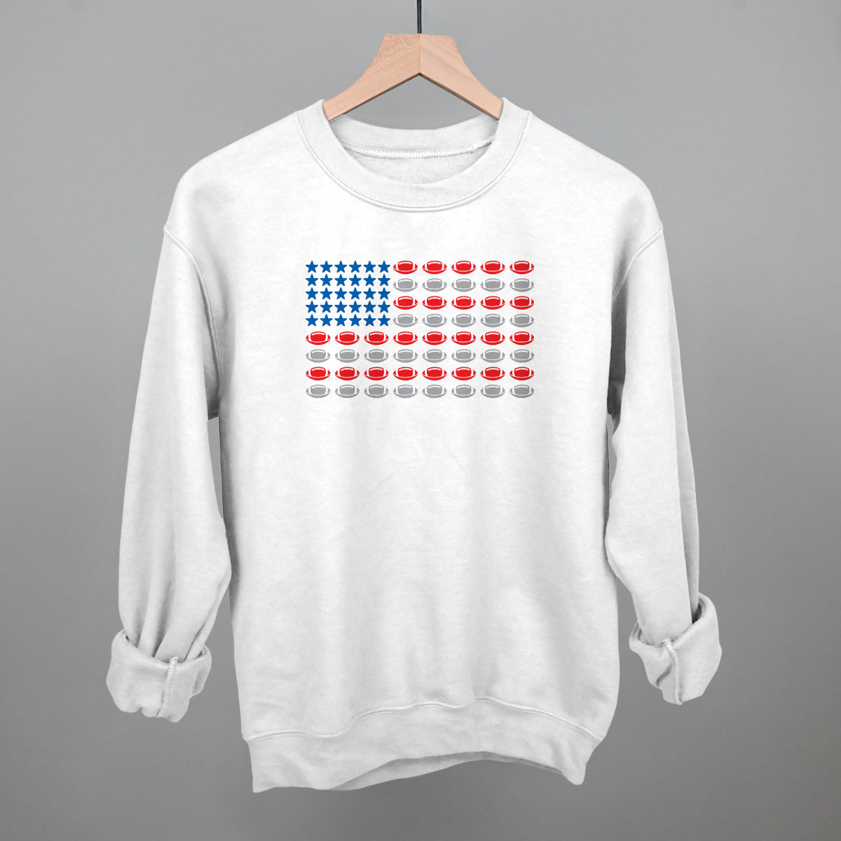 Football American flag design on a white fleece crewneck sweatshirt