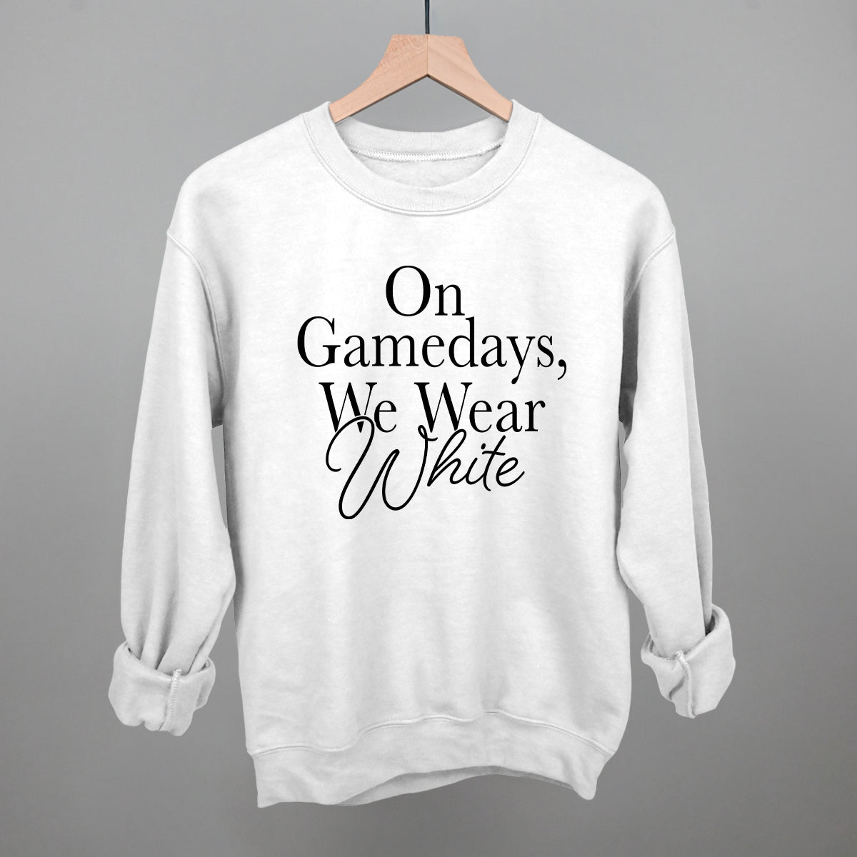 On Game Days We Wear White design on a white fleece crewneck sweatshirt
