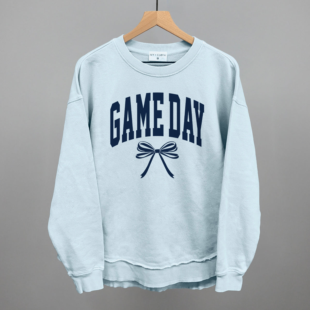 Game Day arch and bow design on a nantucket breeze top