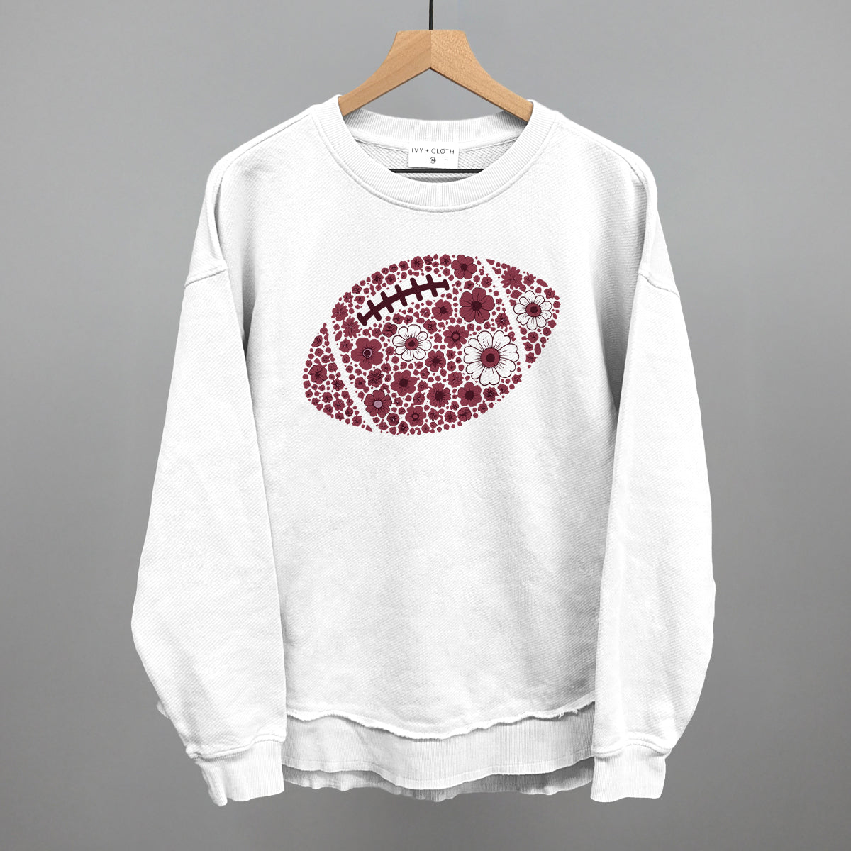 Maroon floral football design shown in white