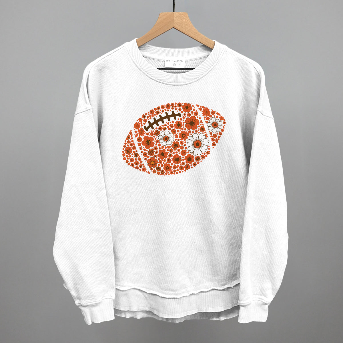 Orange floral football design shown in white