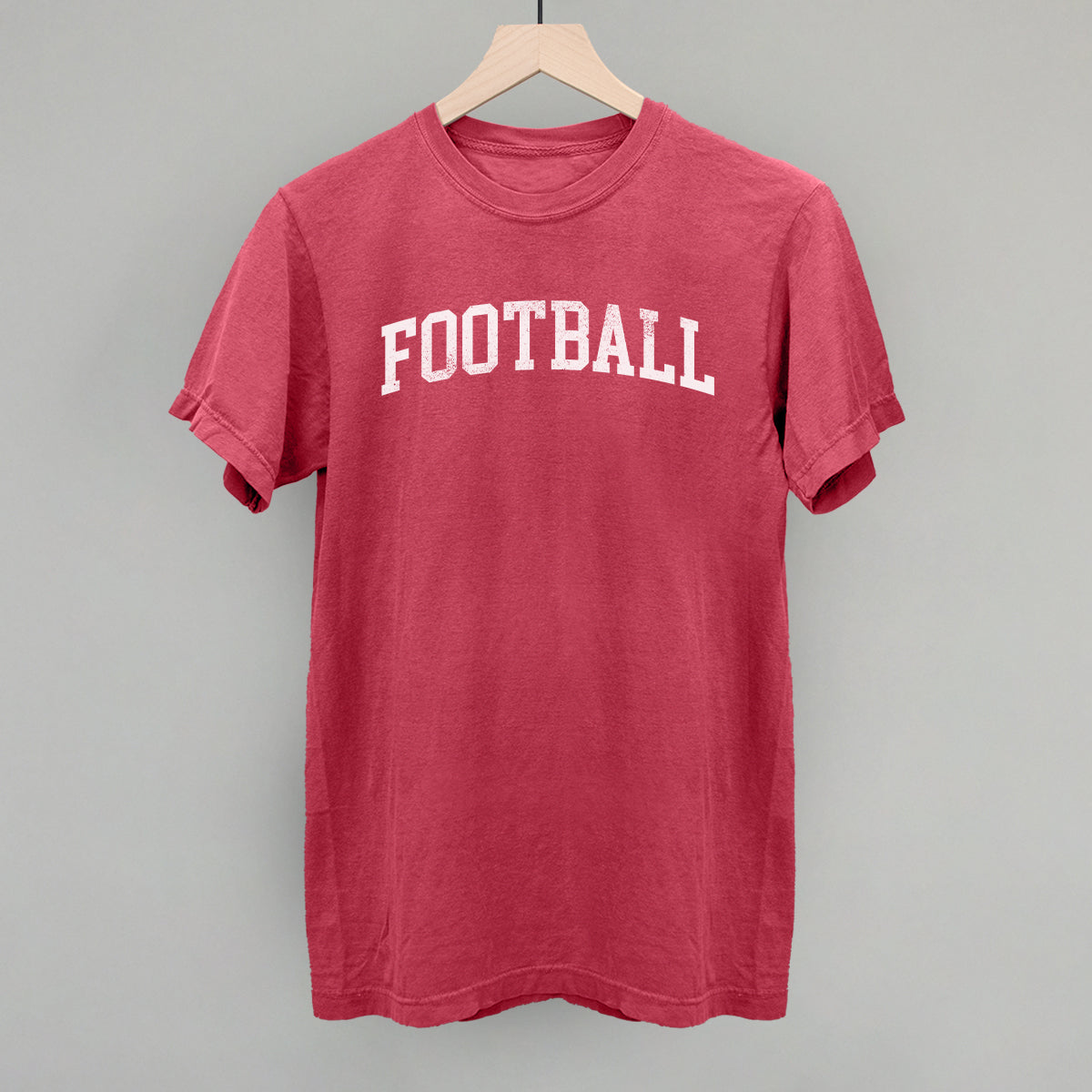 Distressed collegiate football design on a crimson Comfort Colors tee