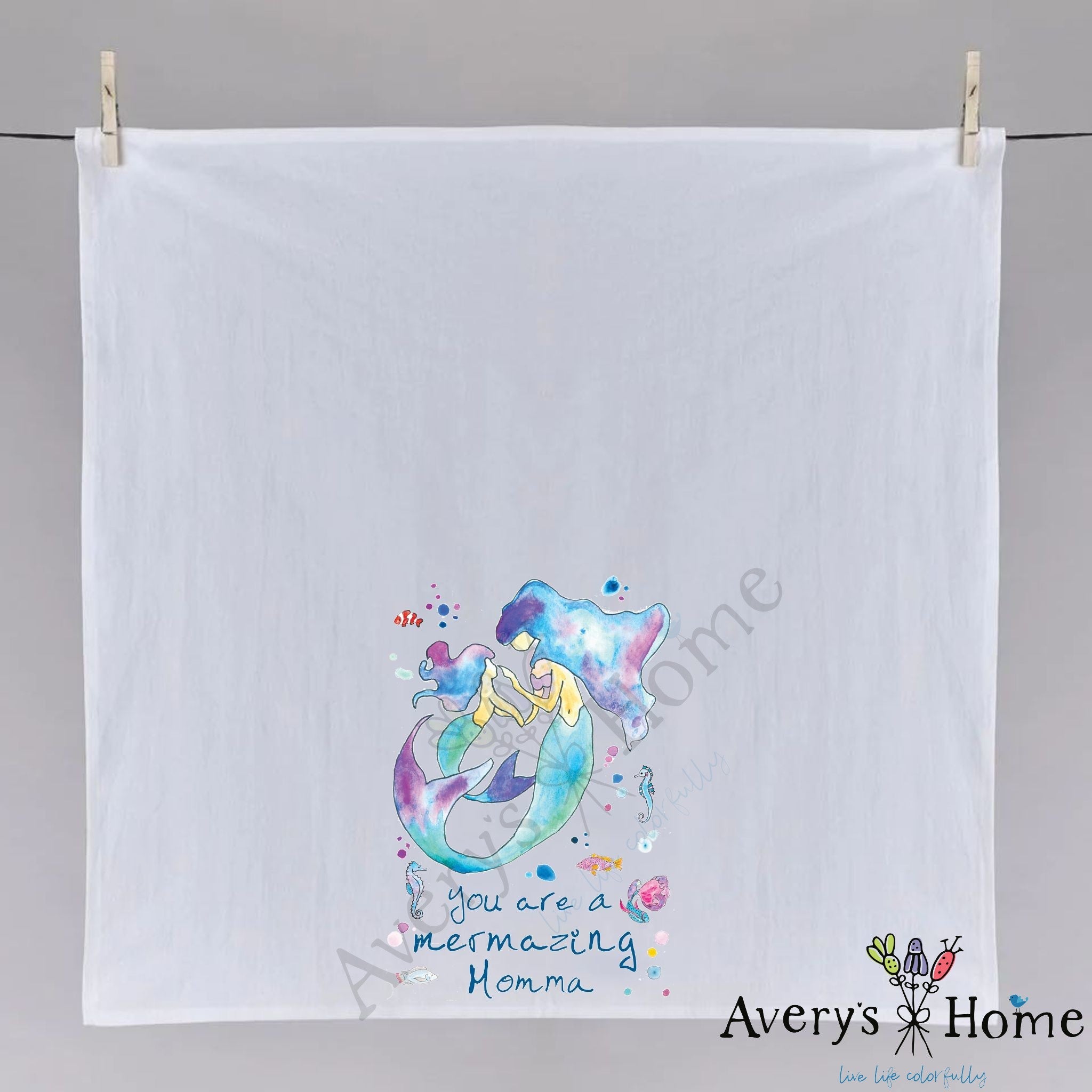 Mermazing Mermaid Momma dish towel hanging in the kitchen
