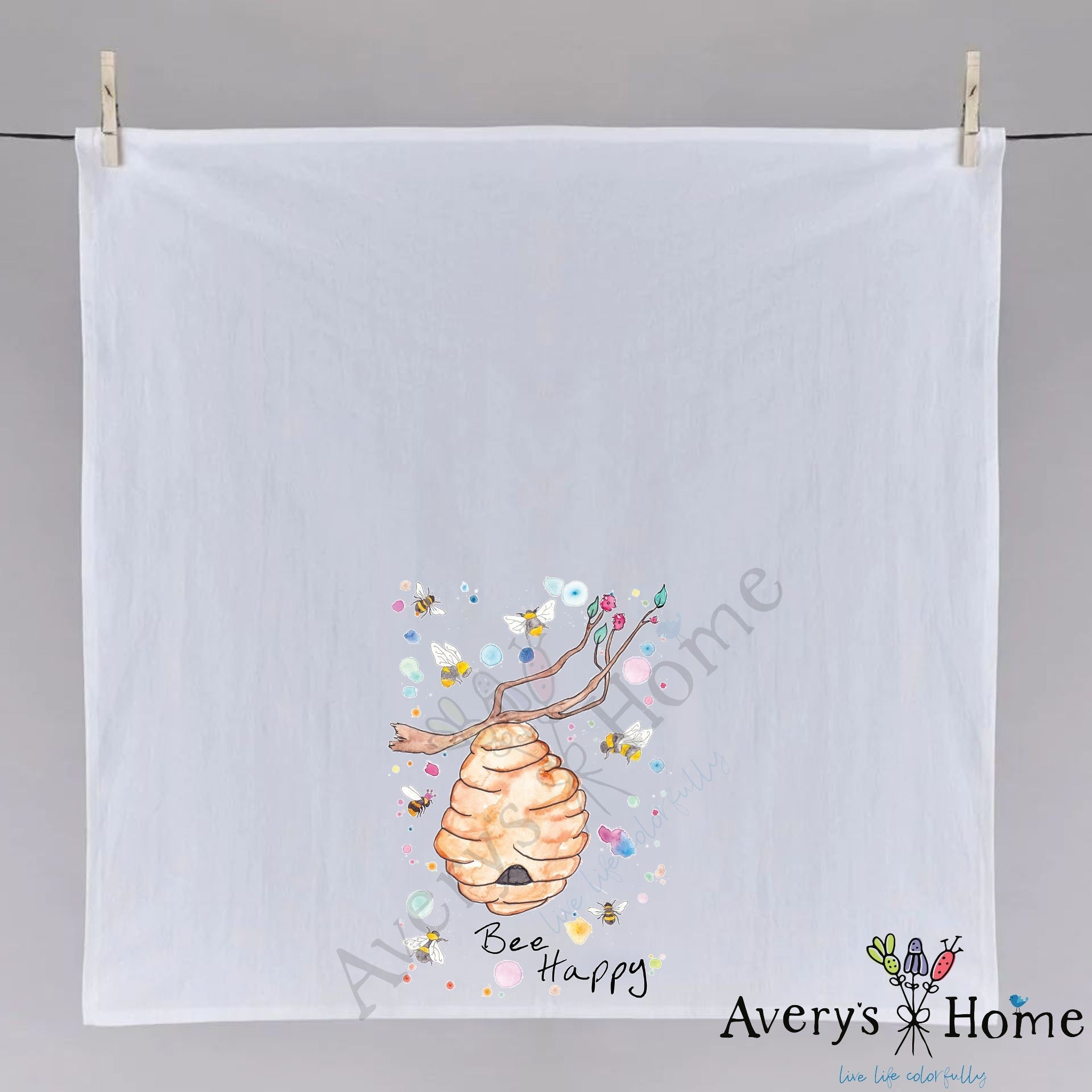 Bee Happy dish towel hanging in the kitchen