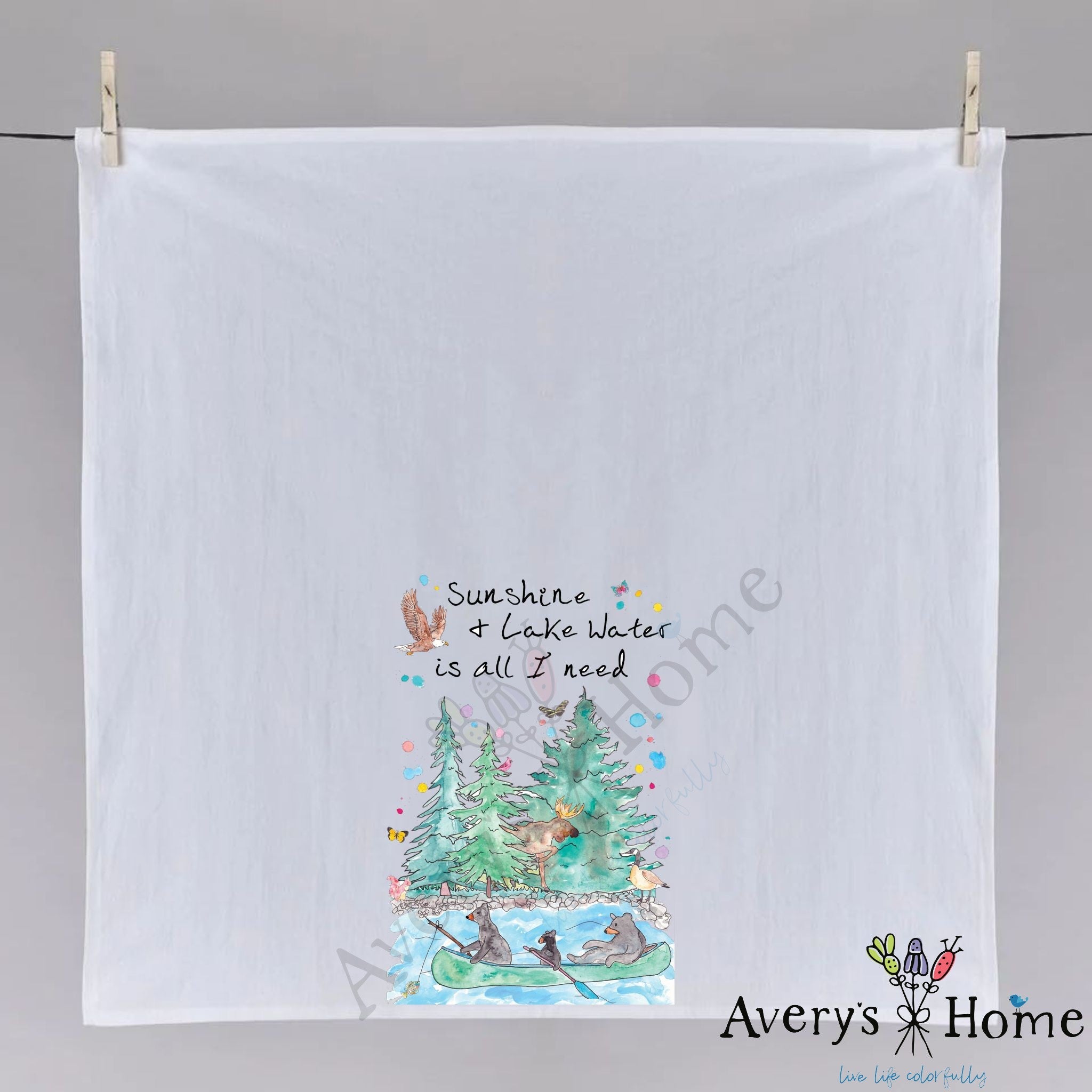 Sunshine and Lake Water dish towel hanging in the kitchen