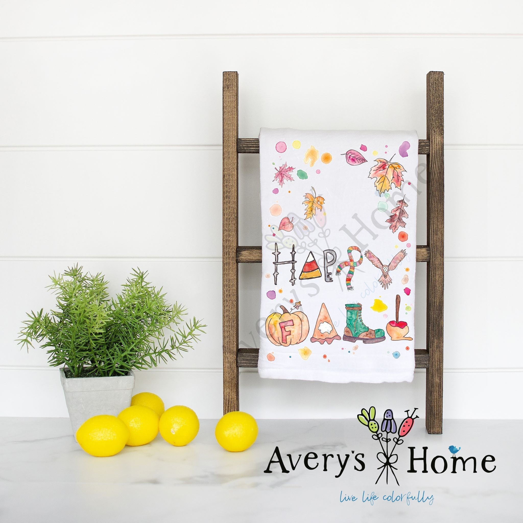 Happy Fall dish towel hanging in the kitchen