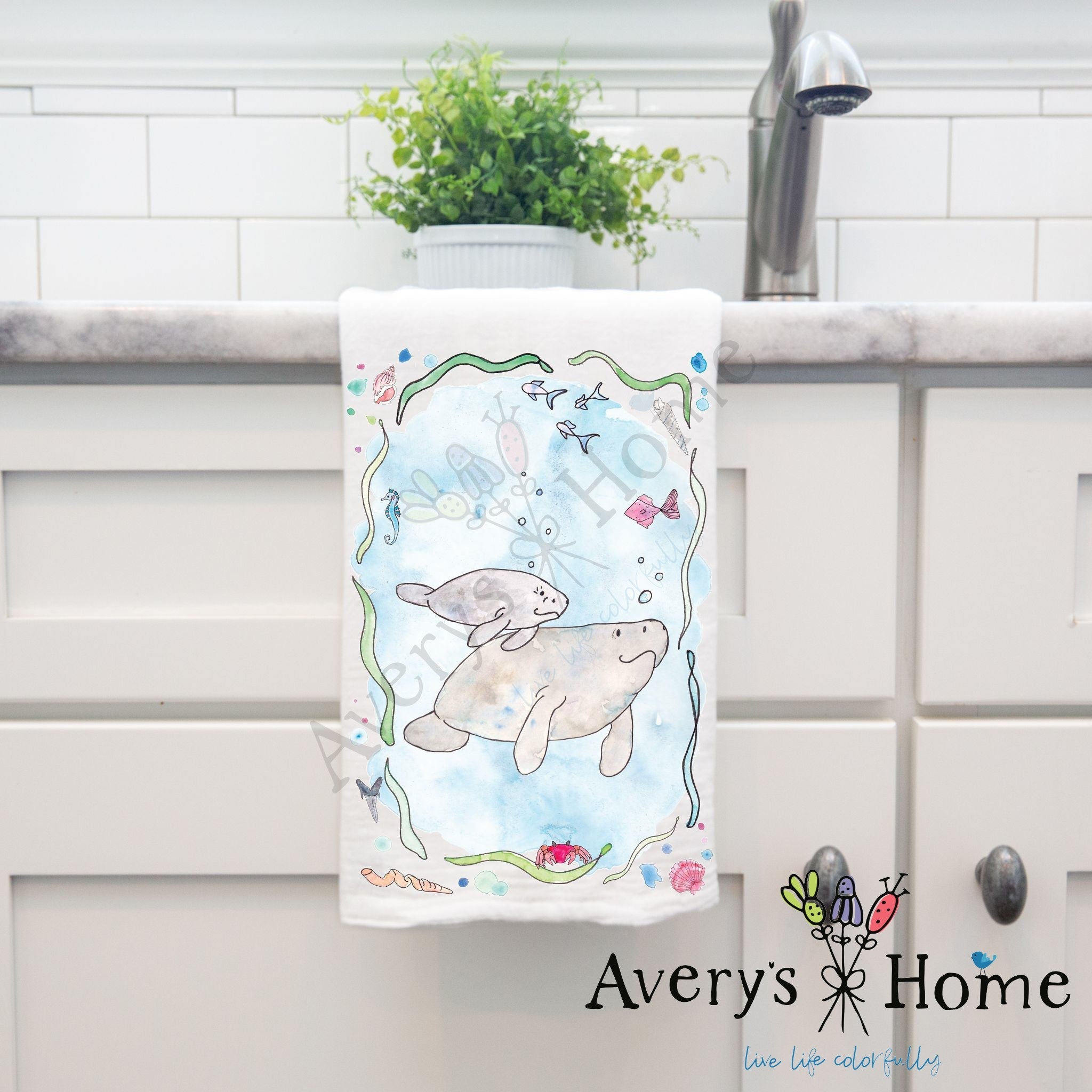 Manatee Mom and Baby dish towel hanging in the kitchen