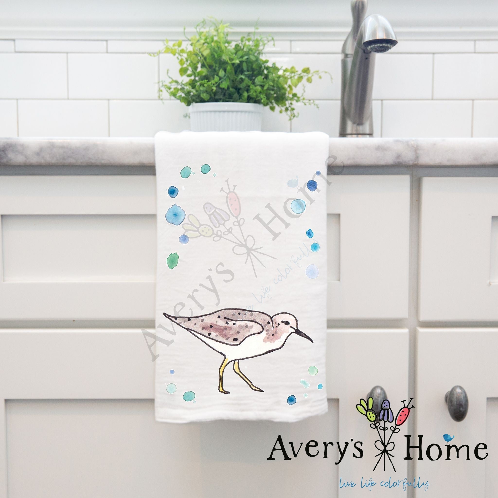 Sandpiper dish towel hanging in the kitchen