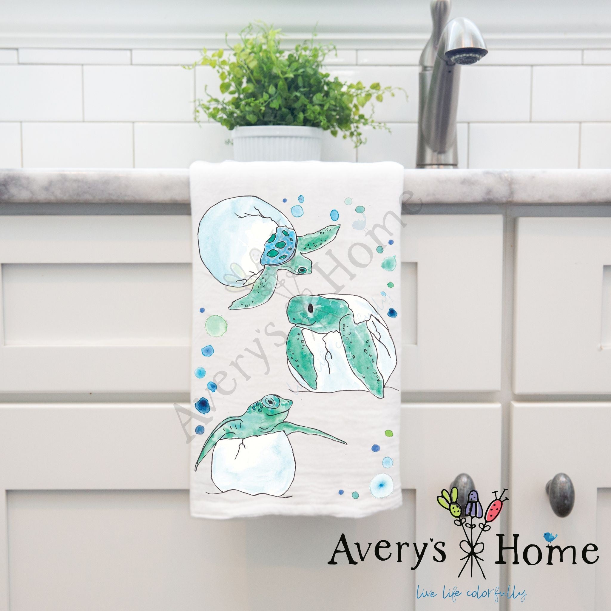 Baby Turtle Eggs dish towel hanging by kitchen sink
