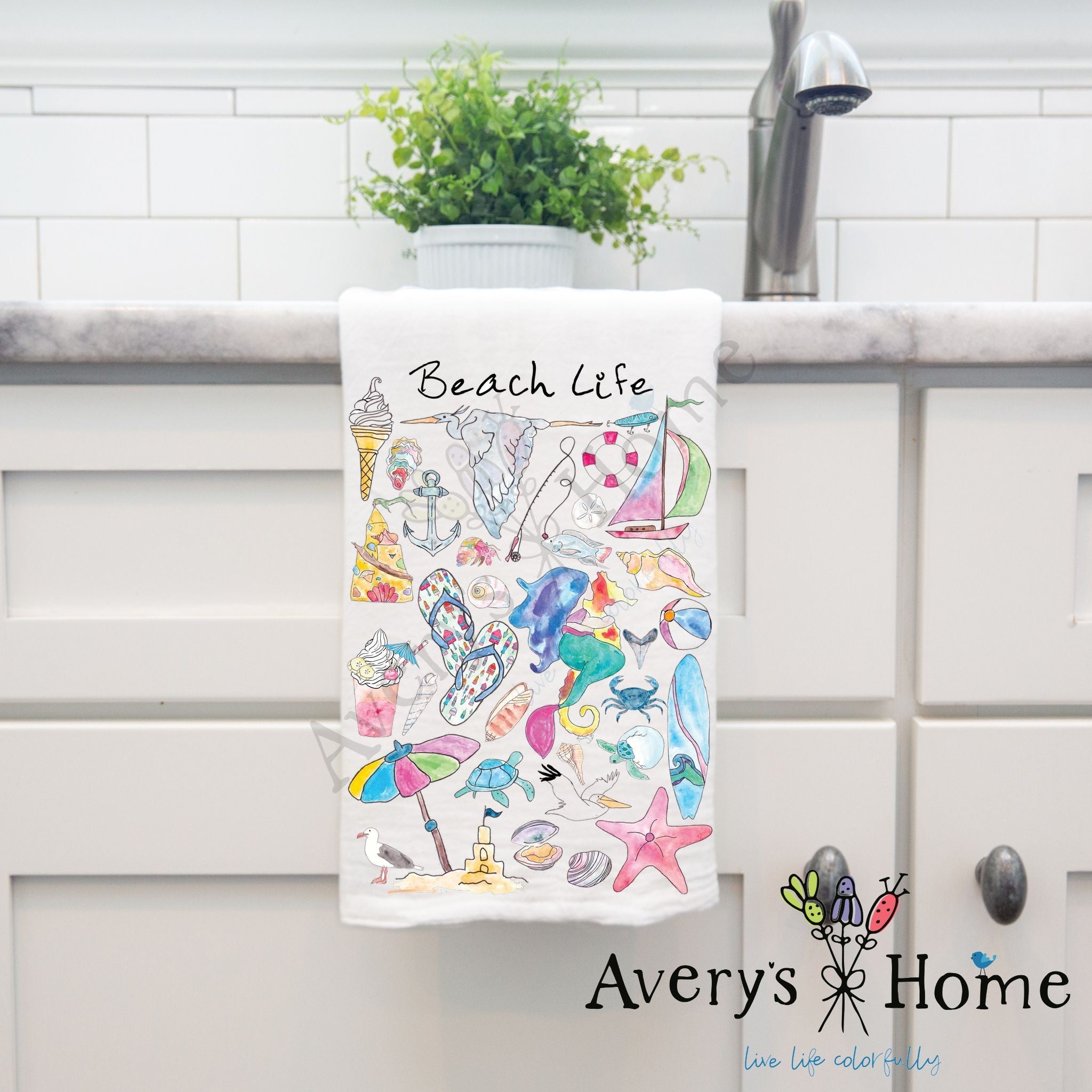 Beach Life dish towel hanging by kitchen sink