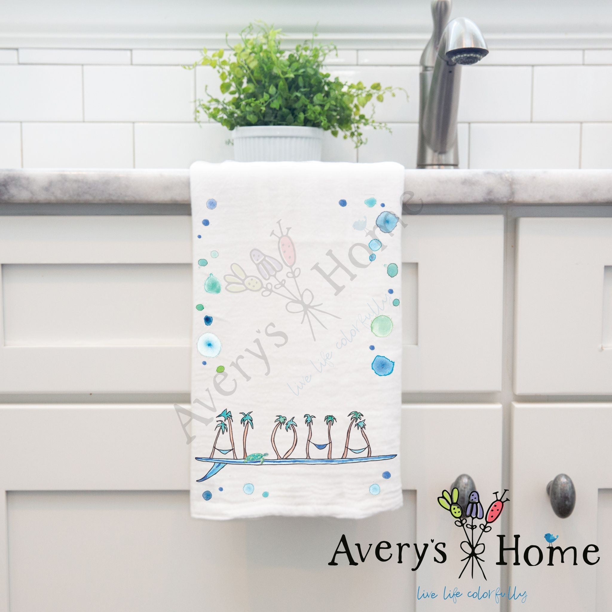 Aloha Surfboard dish towel hanging by kitchen sink