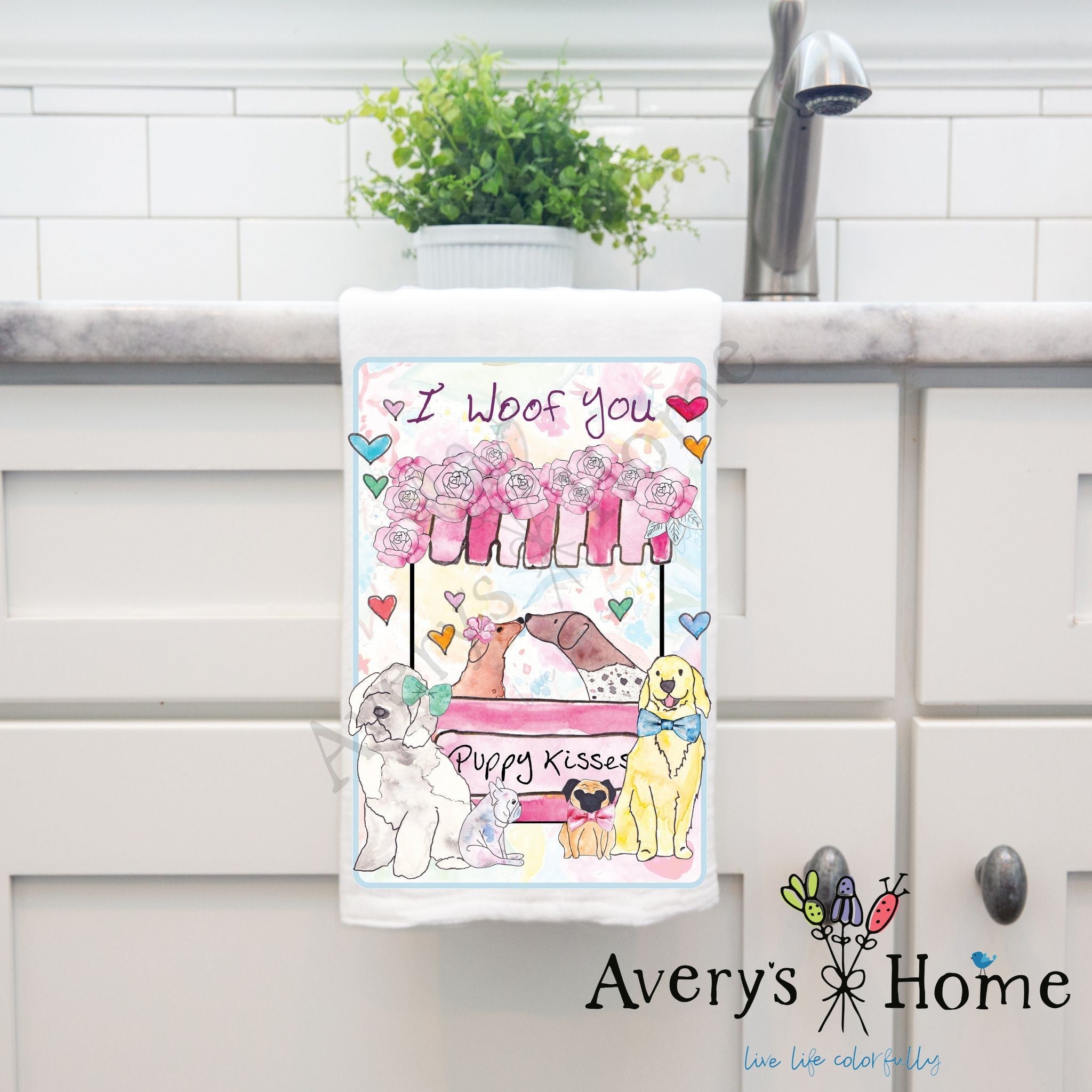 I Woof You Puppy Kisses dish towel hanging by kitchen sink