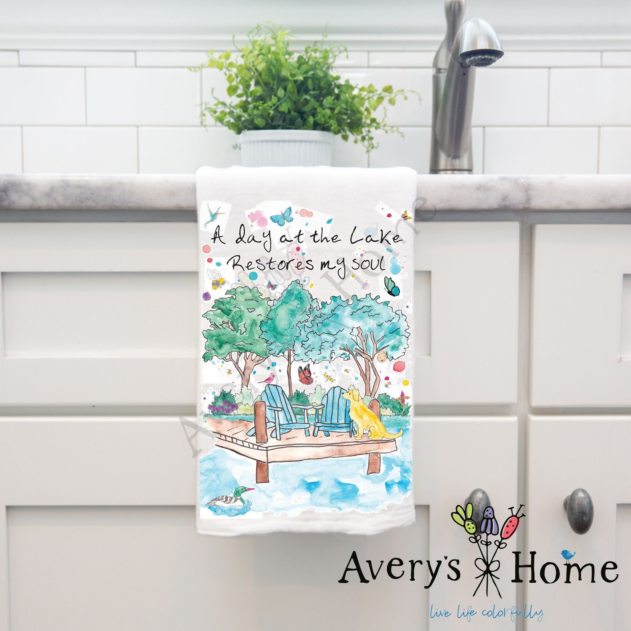 A Day at the Lake dish towel hanging in the kitchen