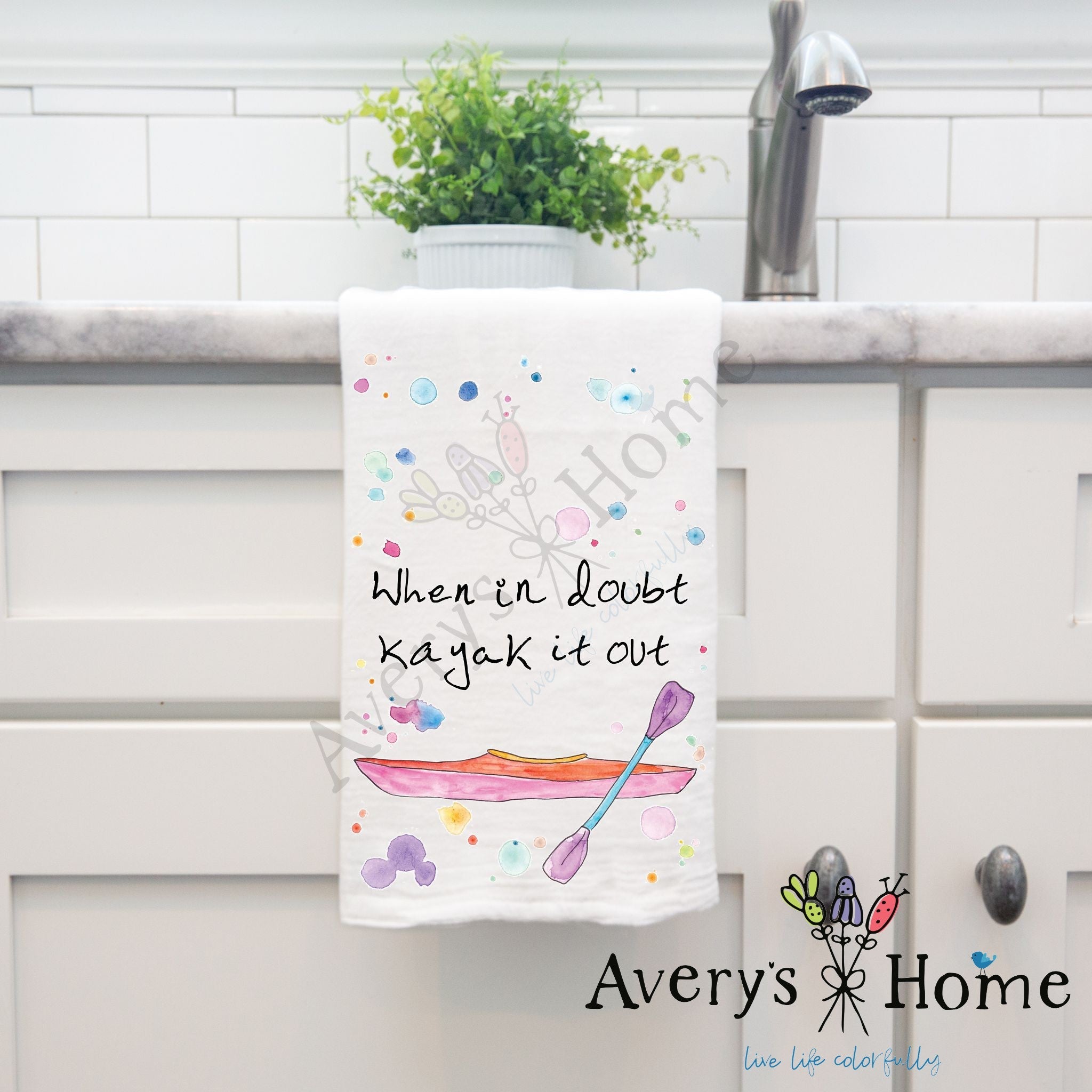 Kayak it Out dish towel hanging in the kitchen