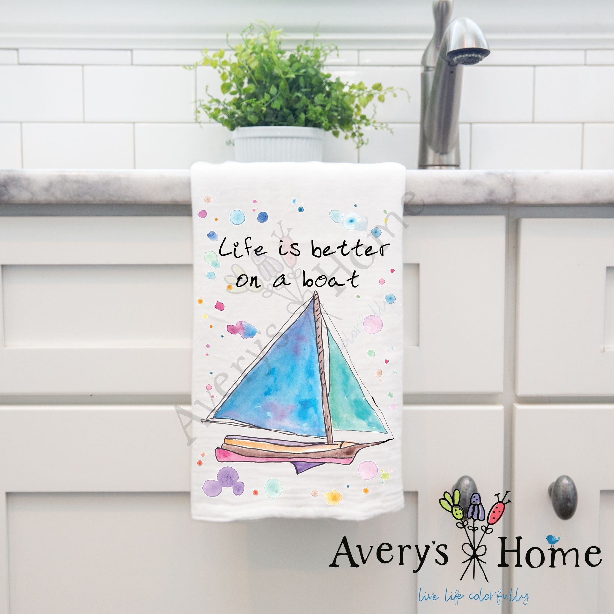 Life is Better on a Boat dish towel hanging in the kitchen