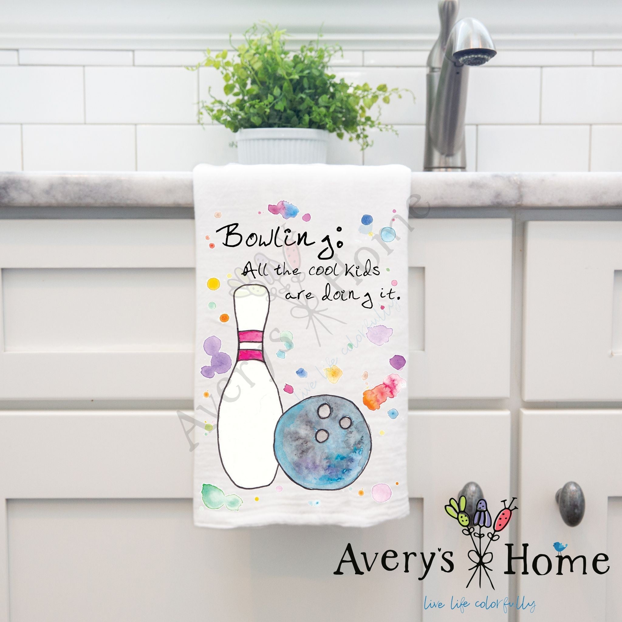 All the Cool Kids Bowl dish towel hanging by kitchen sink