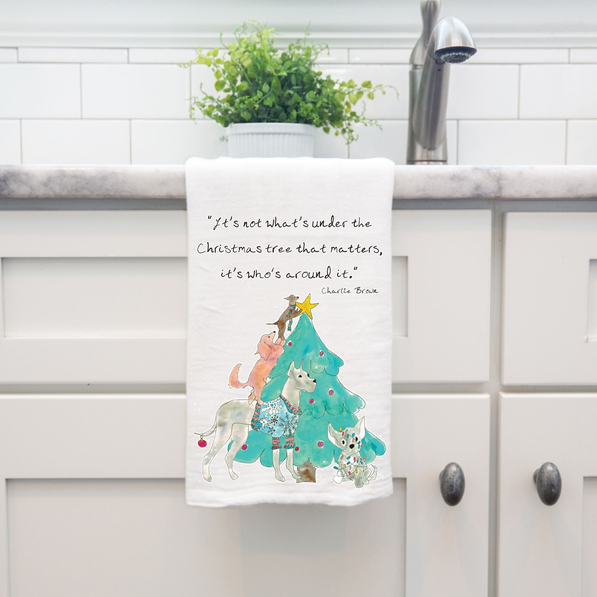 Dogs with Christmas Tree dish towel hanging by kitchen sink