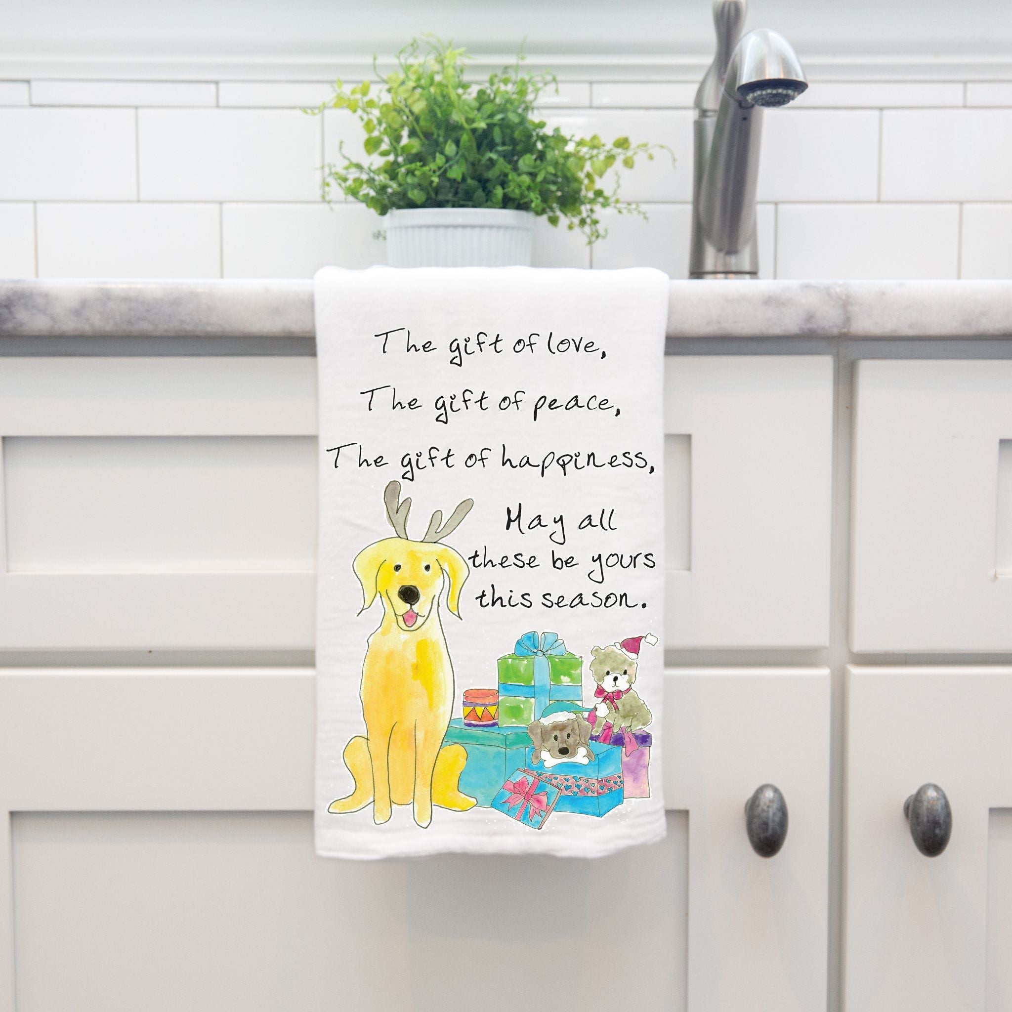 Christmas Gifts of Love Peace Happiness dish towel hanging by kitchen sink
