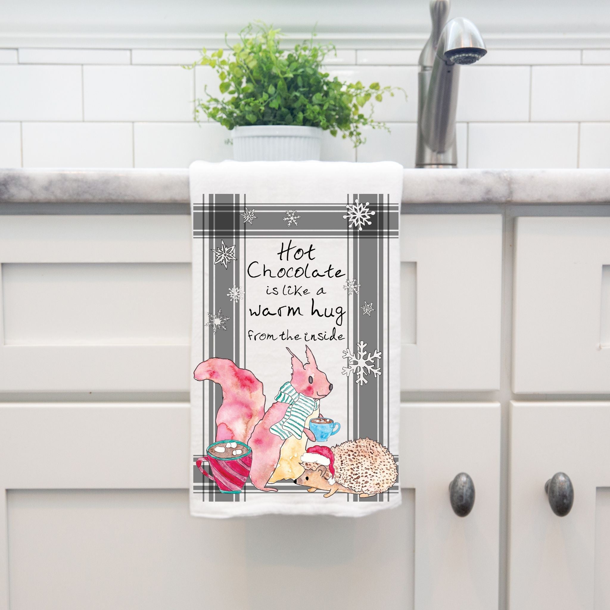 Hot Chocolate is a Warm Hug dish towel hanging by kitchen sink