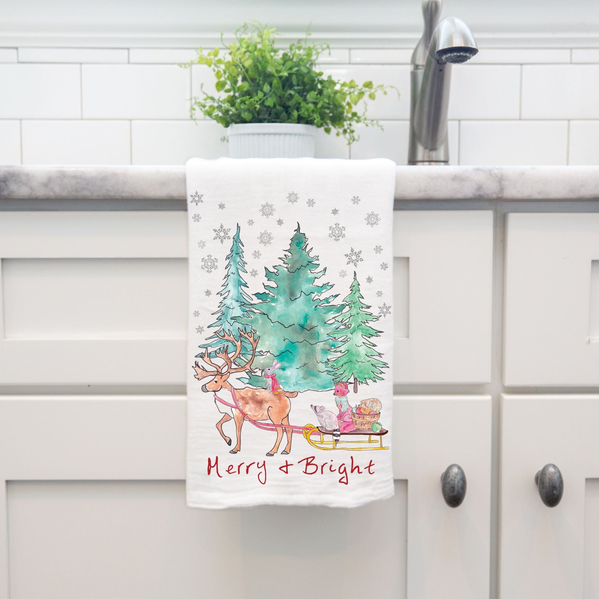Merry and Bright Sleigh Ride dish towel hanging in the kitchen