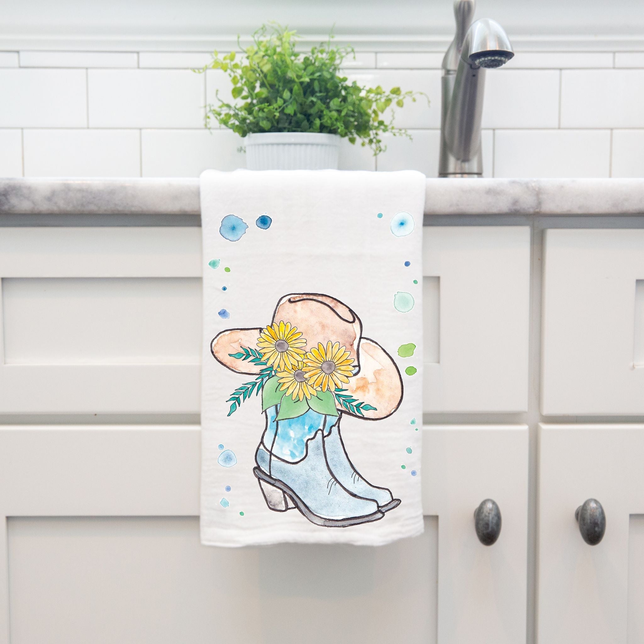 Cowgirl Boots and Hat dish towel hanging in the kitchen