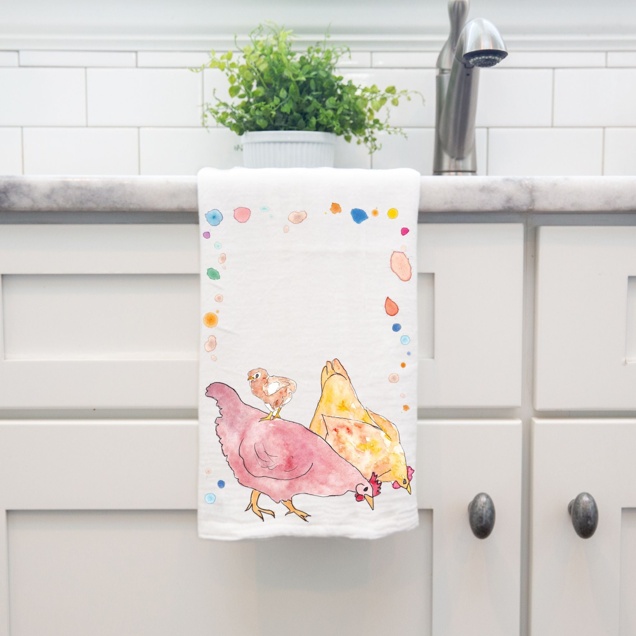 Chickens dish towel by kitchen sink