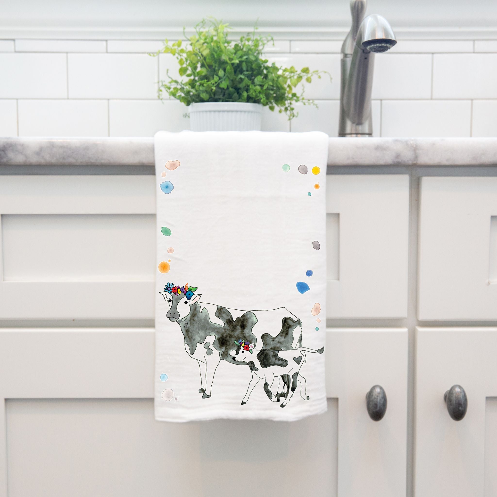 Cows dish towel hanging by kitchen sink