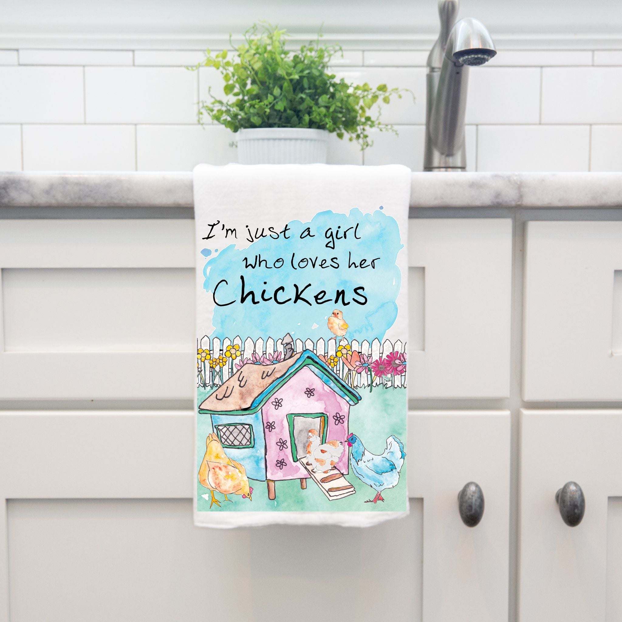 Girl Who Loves Chickens dish towel hanging by kitchen sink