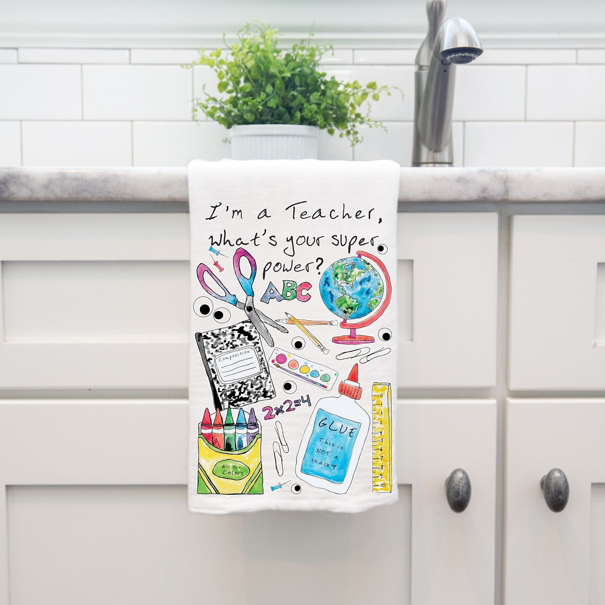 I'm a Teacher dish towel hanging by kitchen sink